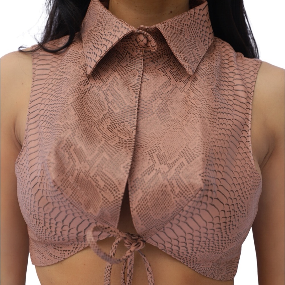 Cute croc top with button collar and pointy bra.